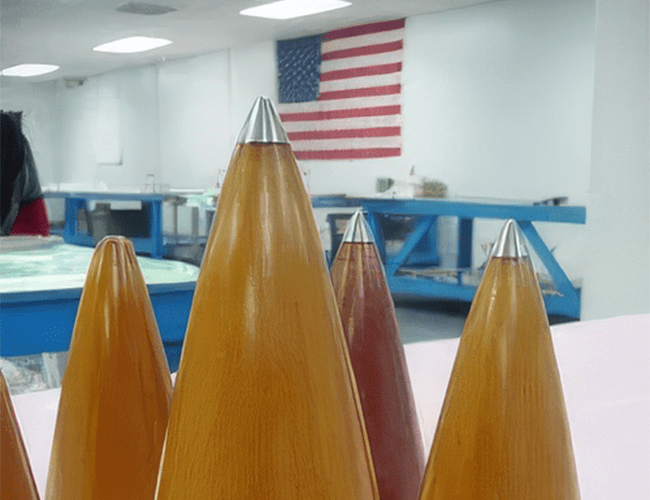 A group of pencils sitting in front of an american flag.