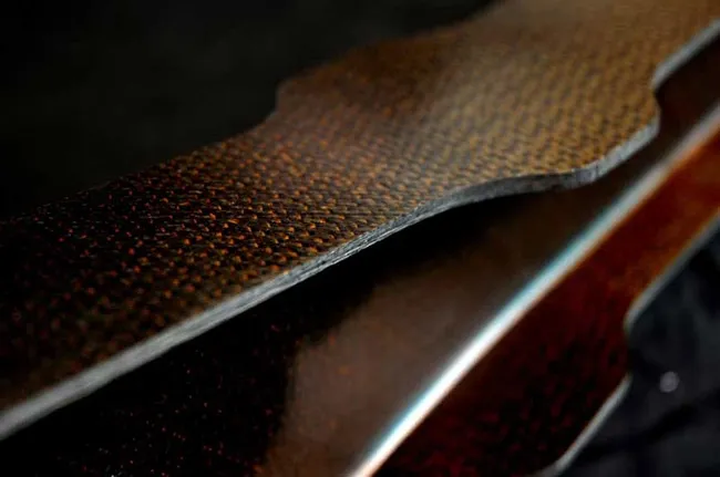 A close up of the leather on a guitar
